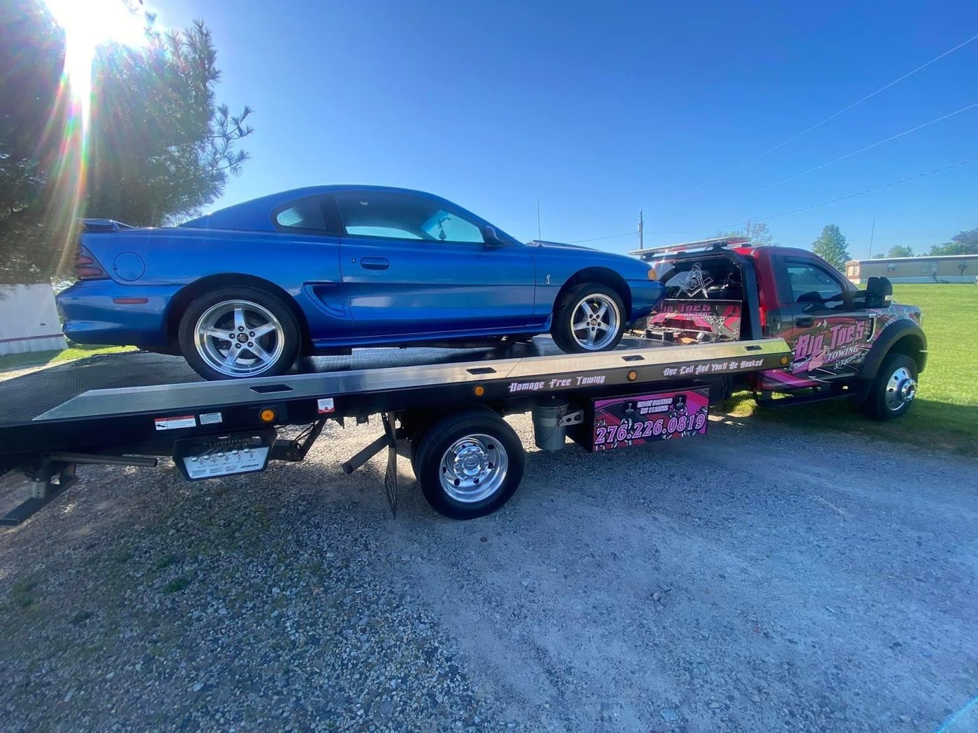 Big Toe's flatbed with a car loaded